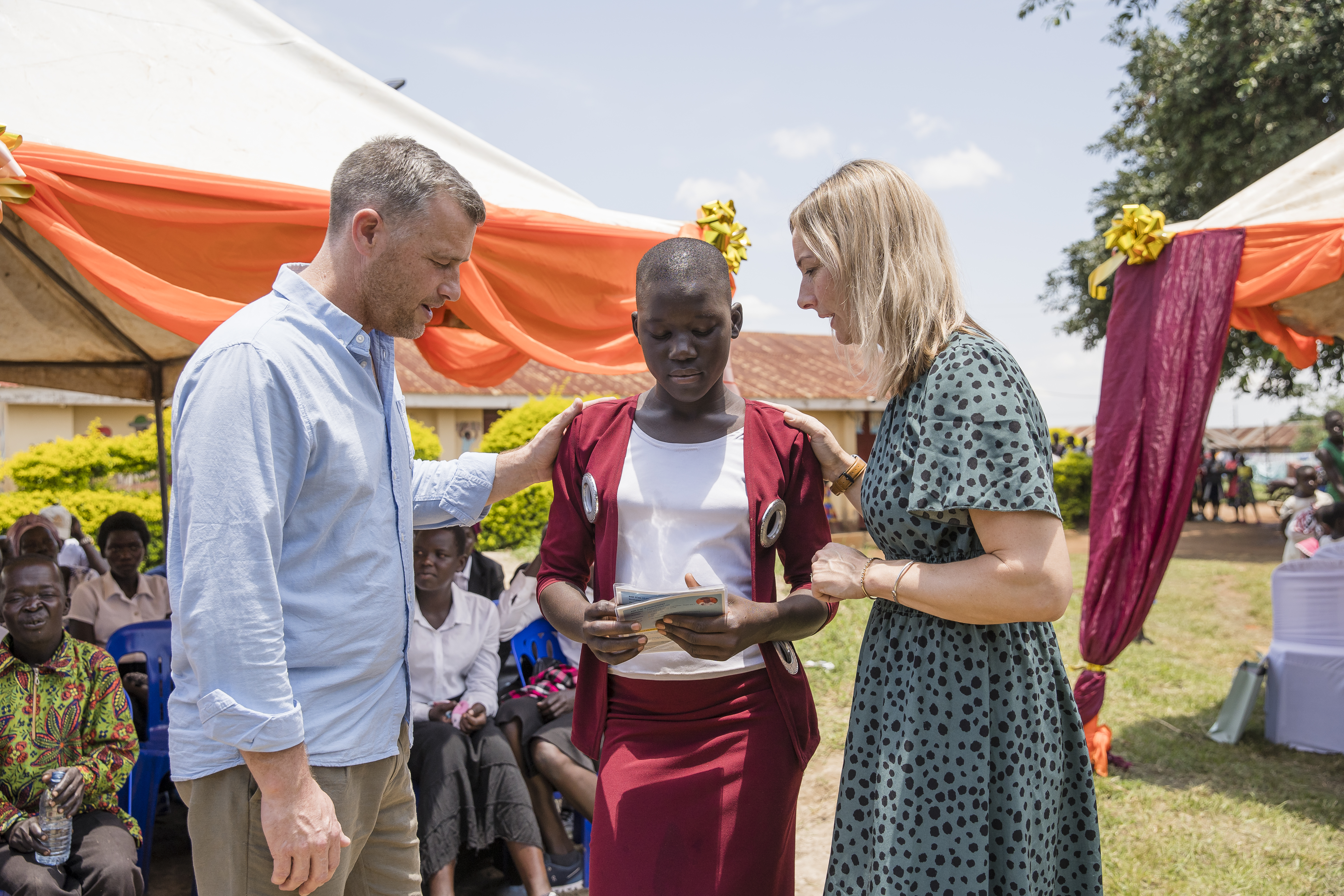 Nathan and Kirsty praying with sponsor child Nathan and Kirsty praying with sponsor child