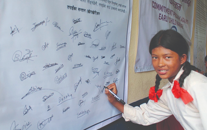 Signing her name for a promising future Signing her name for a promising future